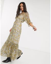 asos design premium broderie maxi dress with pep hem and fluted sleeves