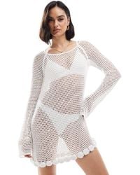 Mango - Robe courte à manches longues au crochet avec détail rose - Lyst