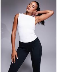 4505 - Icon High Neck Tank With Inner Bra - Lyst