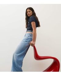 Bershka - Petite High-Waist Wide-Leg Ripped Jeans - Lyst