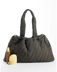 4505 - Woven Logo Quilted Tote With Adjustable toggle - Lyst