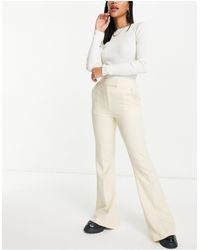 TOPSHOP - Pantaloni skinny a zampa lunghi, color latticello - Lyst