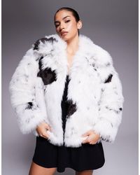 ASOS - Manteau fausse fourrure à col montant et imprimé vache - crème et noir - Lyst