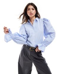 ASOS - Camisa azul a rayas con mangas voluminosas y volantes en los puños - Lyst