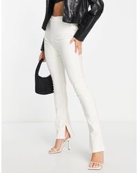 Stradivarius - Coated Flare Jean With Split Hem Detail - Lyst