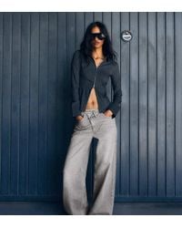 Bershka - Petite Wide-leg Cross-waist Jeans - Lyst