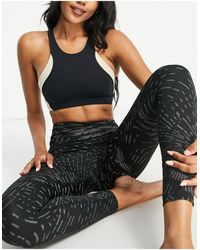 Nike - Nike - yoga swoosh dri-fit - reggiseno sportivo cut & sew a sostegno medio - Lyst