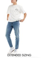 ASOS - Stretch Tapered Jeans With Tint - Lyst