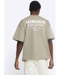 River Island - T-shirt a maniche corte kaki chiaro con scritta "luminis" - Lyst