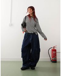 Monki - – langärmliges, schwarzes oberteil mit weißen streifen - Lyst