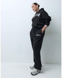Kaiia - Plus – jogginghose aus baumwollmix - Lyst