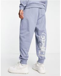 ASOS Asos Dark Future Co-ord Relaxed sweatpants With Logo Print - Blue