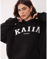 Kaiia - Plus - sweat à capuche d'ensemble oversize sport en coton mélangé avec logo brodé - Lyst