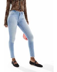 ONLY - Vaqueros Azul Claro De Corte Pitillo Con Bajos Deshilachados Blush De - Lyst