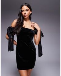 Kaiia - Exclusive Velvet Off Shoulder Oversized Bow Detail Mini Dress - Lyst