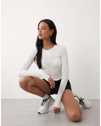 4505 - Lightweight Active Ruched Front Long Sleeve Running Top - Lyst