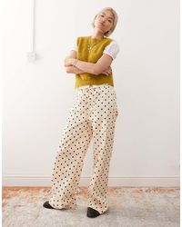 Reclaimed (vintage) - Pantaloni Con Fondo Ampio Color Crema A Pois Neri - Lyst