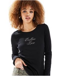 Monki - Long Sleeve Fitted Top With Endless Love Crystal Placement - Lyst