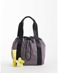 4505 - Woven Adjustable Drawstring Bucket Bag With External Pocket - Lyst