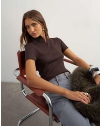 TOPSHOP - High Neck Zip Through Short Sleeve Rib Top - Lyst