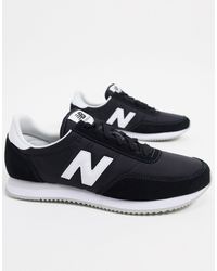 all black new balance trainers
