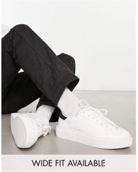 ASOS - Sneakers stringate con suola spessa bianche - Lyst