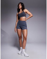 4505 - 3-inch High Waist Running Shorts With Zip Phone Pocket - Lyst