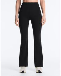 Oysho - Raise Up Compressive 80cm Flare Trousers - Lyst