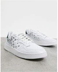adidas originals x fiorucci supercourt trainers in white