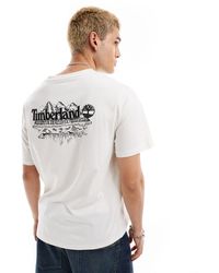 Timberland - T-shirt oversize sporco con stampa grande di montagne sulla schiena - Lyst