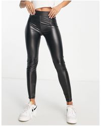 Bershka Petite Faux Leather leggings in Black | Lyst