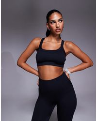 4505 - Seamless Sculpting Medium Support Sports Bra With Adjustable Straps - Lyst