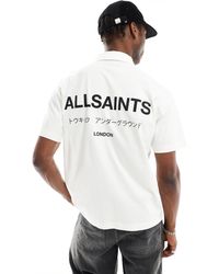 AllSaints - Underground - polo a maniche corte bianca - Lyst