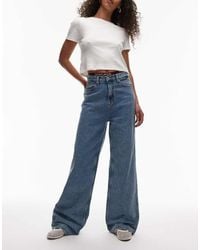 Tommy Hilfiger - Vaqueros De Talle Alto Y Pernera Ancha Con Lavado Medio Claire De -Azul - Lyst