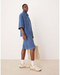 ASOS - Pantalones Cortos Vaqueros De Corte Alargado Con Lavado Azul Medio Y Detalle De Costuras De (Parte De Un Conjunto) - Lyst