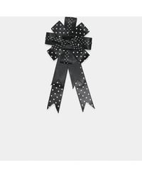 Stradivarius - Brosche mit polka-dot-schleife - Lyst