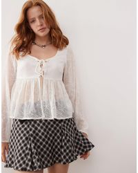Reclaimed (vintage) - Tie Front Top With Peplum Hem And Bow Embroidery - Lyst