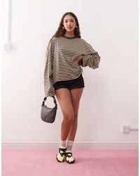 Lioness - – bloom – langärmliges, kastiges t-shirt aus baumwollmix mit rundhalsausschnitt und streifen - Lyst