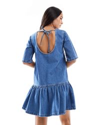 ASOS - Robe t-shirt courte en denim avec taille basse - moyen délavé - Lyst