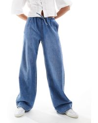 Stradivarius - – str – e jeans mit elastischem bindegürtel und besonders weitem bein - Lyst