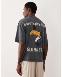 ASOS - Oversized T-shirt With Guinness Print - Lyst