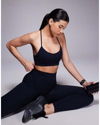 4505 - Seamless Baby Rib Light Support Sports Bra - Lyst