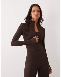 4505 - Seamless Baby Rib Cropped Zip Up Long Sleeve Top - Lyst