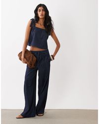 Mango - Calonge Tie Waist Pleated Front Wide Leg Denim Pants - Lyst
