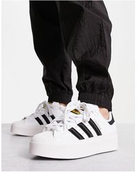 adidas Originals - Superstar bonega - sneakers bianche e nere con suola platform - Lyst