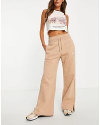 Brown Nike Track pants and sweatpants for Women | Lyst