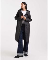 Vero Moda - Giacca Impermeabile Taglio Lungo Nera Con Cappuccio - Lyst