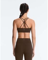 Oysho - Comfortlux Light Support Sports Bra With Crossover Straps - Lyst