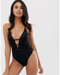 River Island Costume da bagno con scollo profondo e fiori applicati - Nero