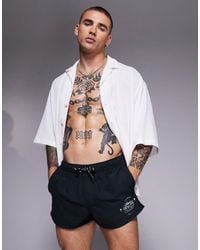 ASOS - Pantaloncini Da Bagno Taglio Super Corto Neri Con Stampa Bianca - Lyst